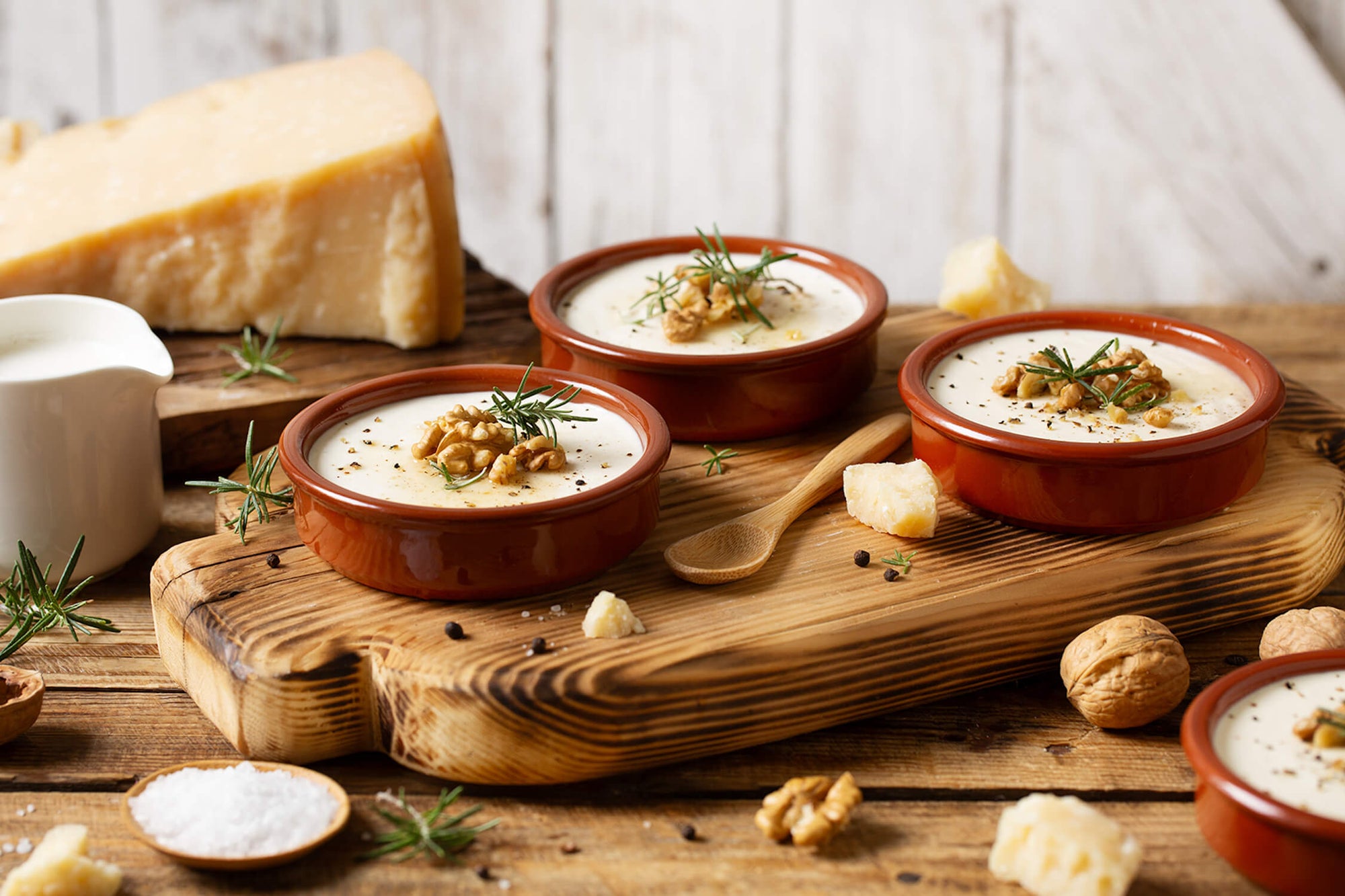 SAVORY PANNA COTTA with Parmigiano Reggiano cheese, walnuts, rosemary, pepper, and honey
